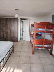 Una cama o camas en una habitación de El arrayán costero