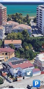 an aerial view of a city with buildings and the ocean at B&B Le Mansarde in Pescara