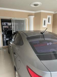 a silver car parked in a garage at excelente casa para COP 30 in Belém