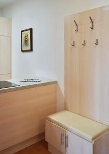 a kitchen with a counter with a bench in it at Wilena Apartments in Villach