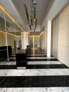 a lobby of a building with black and white tiles at Nice Studio in Palermo Soho in Buenos Aires