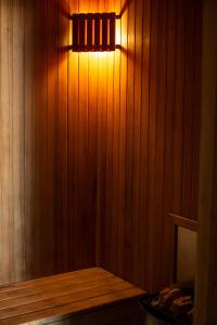 a light in a sauna with a wooden wall at Nice Studio in Palermo Soho in Buenos Aires +68 photos