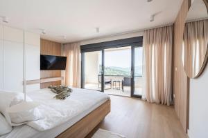 Ένα ή περισσότερα κρεβάτια σε δωμάτιο στο The One in Konavle, luxury villa near Dubrovnik +72 φωτογραφίες