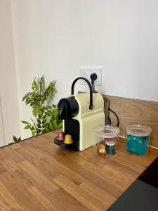 a toaster sitting on top of a wooden table at Le Breizh -T2 en centre ville in Rennes