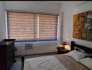 Postel nebo postele na pokoji v ubytování Apartment on Margarita Island