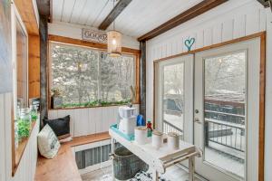 a tiny house with a table and a window at 11 Mi to Bozeman Family Home with Movie Room! in Belgrade