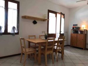 a dining room with a wooden table and chairs at Two Bedrooms, Wifi, Near Beach - Ca Greta in Sal Rei