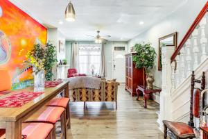 a living room with a table and chairs at 1 Mi to Philadelphia Zoo Convenient Townhome! in Philadelphia
