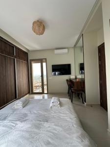 Kama o mga kama sa kuwarto sa Appartement vue océan