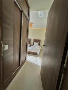 Kama o mga kama sa kuwarto sa Appartement vue océan