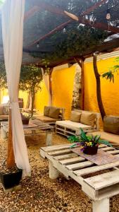 a room with a tent and a bench and a table at Mohana in Puerto Colombia +9 photos