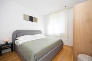 Postel nebo postele na pokoji v ubytování Apartment Apinelo