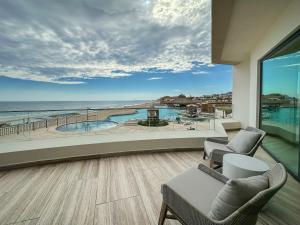 a living room with a view of the ocean at 3BR Ground Floor Condo with Direct Pool Access #109 in Puerto Peñasco