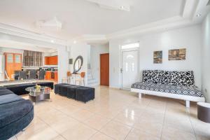 a living room with a couch and a table at Villa Semina in Pastida