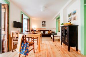 a living room with a table and a dining room at Apartments in Historical Lisbon in Lisbon