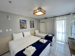 Katil atau katil-katil dalam bilik di Barreirinhas Lençóis Flat Residence