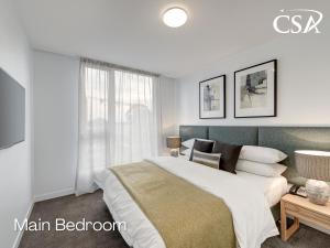 Ένα ή περισσότερα κρεβάτια σε δωμάτιο στο Camberwell Serviced Apartments +16 φωτογραφίες