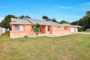 a house with an empty yard in front of it at Renovated 3BR Dog Friendly Pond View WD in Whitfield
