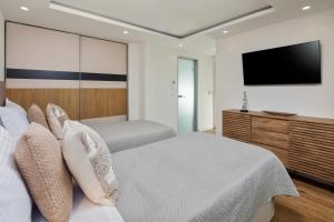Postel nebo postele na pokoji v ubytování Villa Kalithea Corfu
