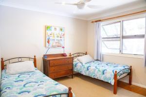 Ένα ή περισσότερα κρεβάτια σε δωμάτιο στο Beach Tree