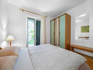 a bedroom with a large white bed and a window at Tranquil Escape in Banjol in Banjol +32 photos