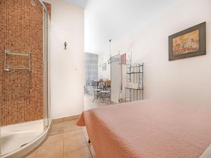a bedroom with a bed and a room with a window at Serene Studio by the Sea in Banjol +32 photos