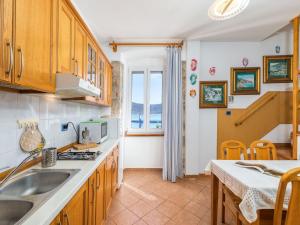 a kitchen with a sink and a counter top at Holiday Home near Beach in Croatia in Cres +32 photos