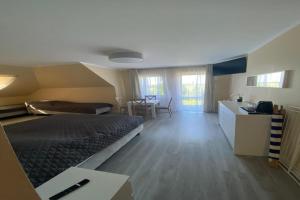 Postel nebo postele na pokoji v ubytování Apartment in Mi dzywodzie near Baltic Beaches + 27 fotografií