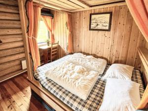 a bedroom with two beds in a cabin at 4 star holiday home in gol in Gol