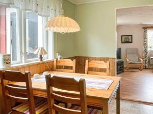 a dining room with a table and chairs at 4 person holiday home in KÖPINGSVIK in Köpingsvik