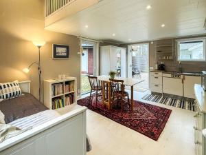 a room with a bed and a table and a kitchen at 6 person holiday home in MÖNSTERÅS in Mönsterås