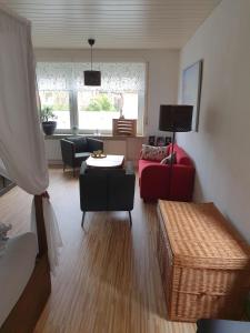 a living room with a couch and a table at Fewo Hein Da Sein in Ahrensbök