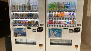 a vending machine filled with lots of bottles of soda at Toyoko Inn Nara Oji eki Minami guchi in Oji +27 photos