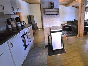 a room with a kitchen and a living room at 4 person holiday home in Föllinge in Föllinge