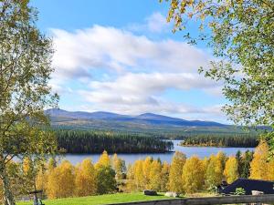 a view of a lake with trees in the background at 4 person holiday home in Föllinge in Föllinge