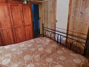 a bedroom with a bed and a wooden door at 4 person holiday home in Föllinge in Föllinge +39 photos