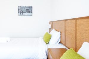 Postel nebo postele na pokoji v ubytování Donchan Residence