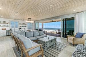 a living room with a couch and a table at 226 South Fletcher 3rd Floor home in Fernandina Beach