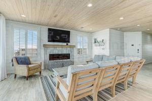 a living room with a couch and a fireplace at 226 South Fletcher 3rd Floor home in Fernandina Beach