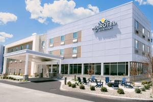 a rendering of the exterior of a hotel at Microtel Inn & Suites by Wyndham Newark NY in Newark