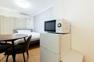 Η κουζίνα ή μικρή κουζίνα στο グリシーヌ警固 Apartment Hotel +46 φωτογραφίες