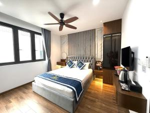 Ένα ή περισσότερα κρεβάτια σε δωμάτιο στο Homestay Lung Linh +3 φωτογραφίες