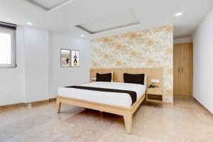 Postel nebo postele na pokoji v ubytování Super Hotel O Tasvi Stayz