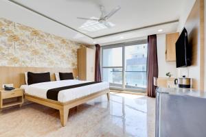 TV a/nebo společenská místnost v ubytování Super Hotel O Tasvi Stayz