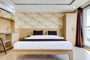 Postel nebo postele na pokoji v ubytování Super Hotel O Tasvi Stayz