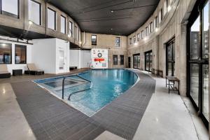 a large swimming pool in a large building at Blue Bliss Indoor Pool, FREE Parking, Near NYC in Elizabeth