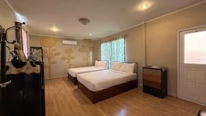 Postel nebo postele na pokoji v ubytování Ville De La Vie Khao Yai + 37 fotografií