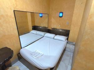 Postel nebo postele na pokoji v ubytování MCT Hotel