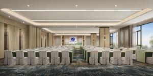 a conference room with rows of tables and chairs at Samsara Hotel Pattaya in Pattaya South