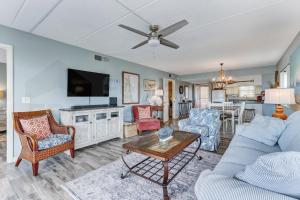 a living room with a couch and a table at N1 Amelia South apts in Fernandina Beach